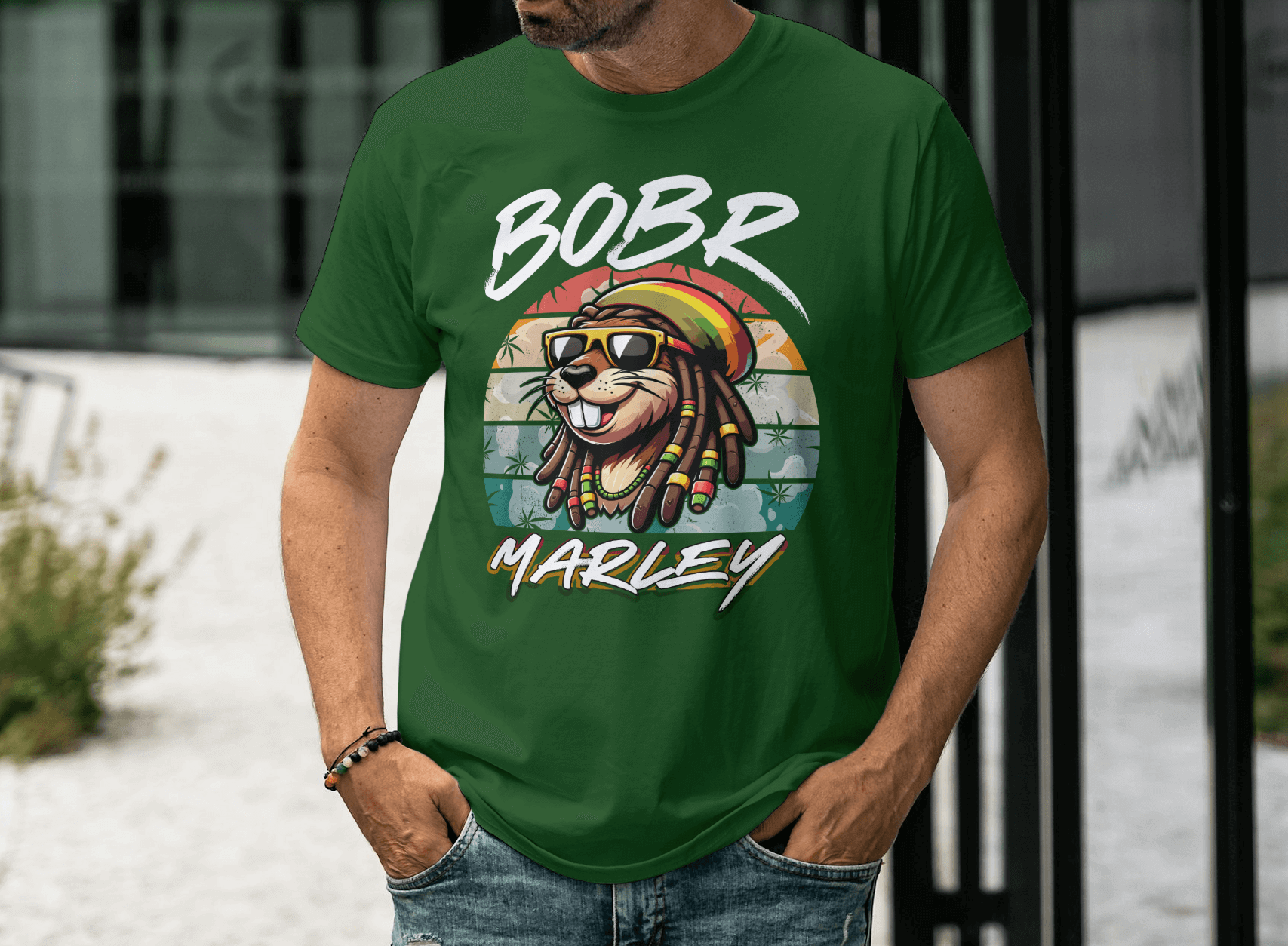 Person wearing a Bobr Marley Shirt with a colorful lion graphic and reggae vibes, set against an outdoor background.