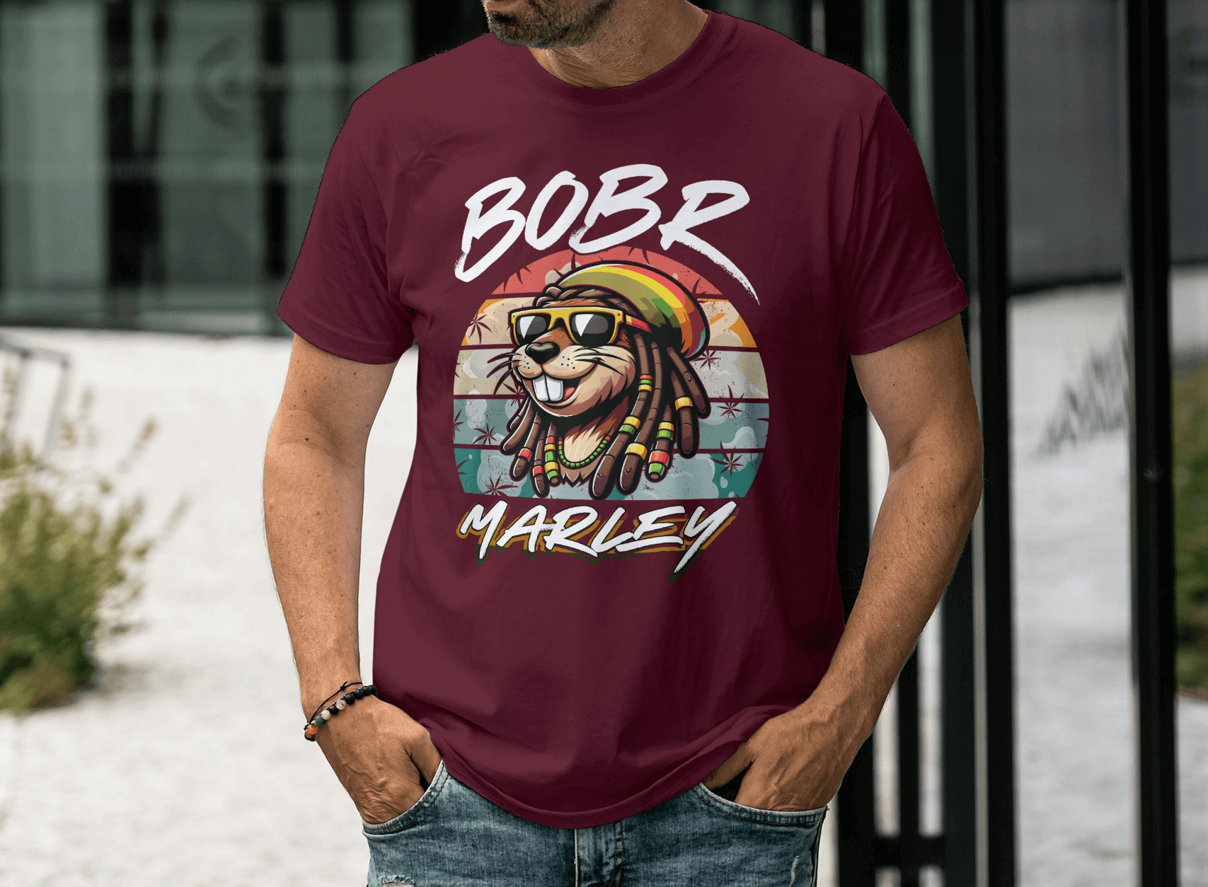 Bobr Marley Shirt featuring a lion graphic with reggae colors on a maroon background.