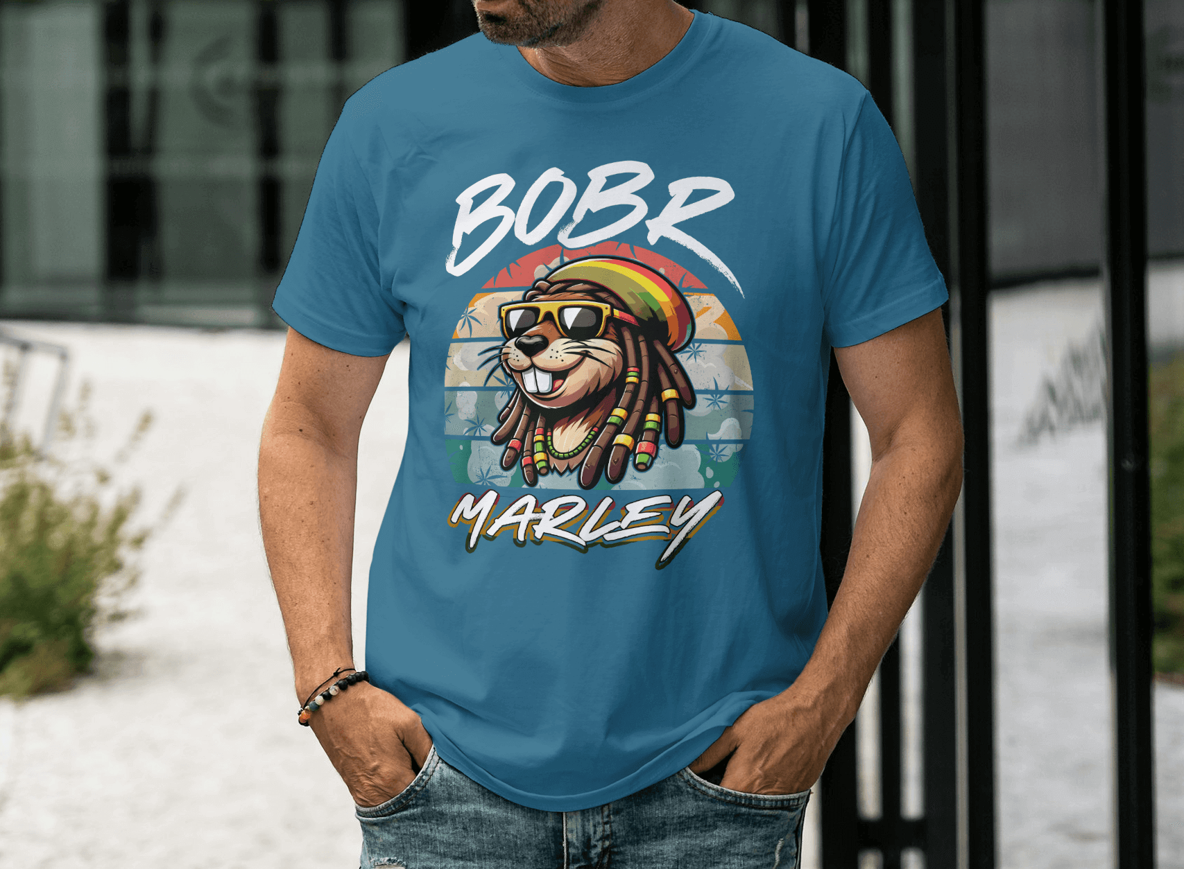 Person wearing a Bobr Marley Shirt featuring a colorful lion design and reggae vibes.