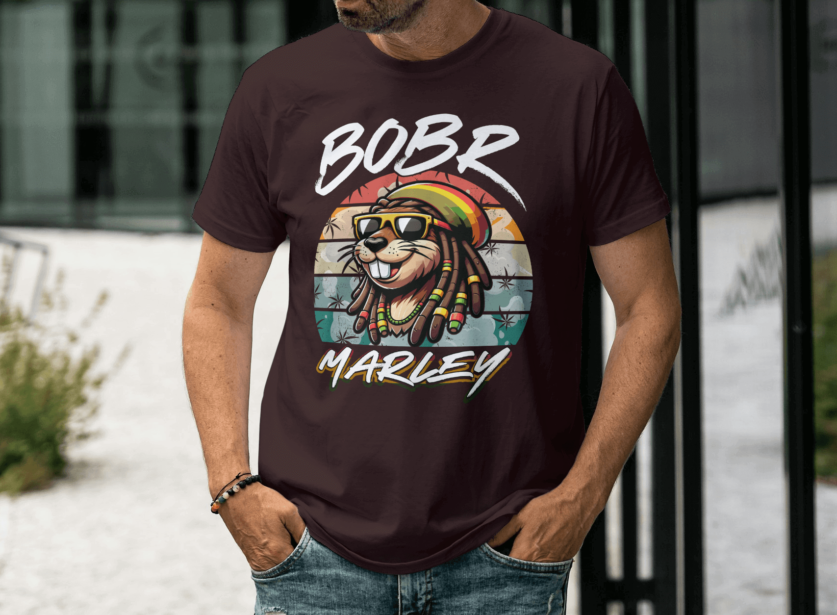 Bobr Marley Shirt featuring a colorful lion graphic and sunglasses on a maroon background.